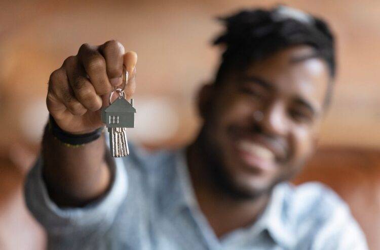 person holding new keys