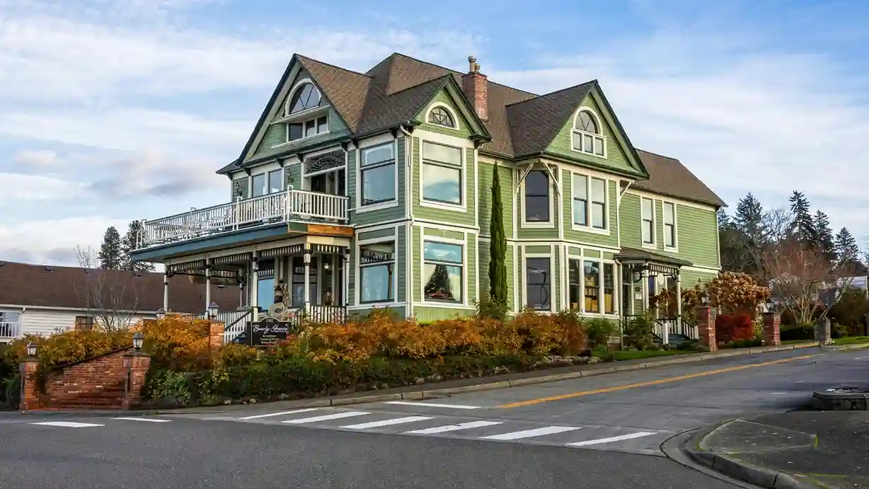light green victorain home exterior