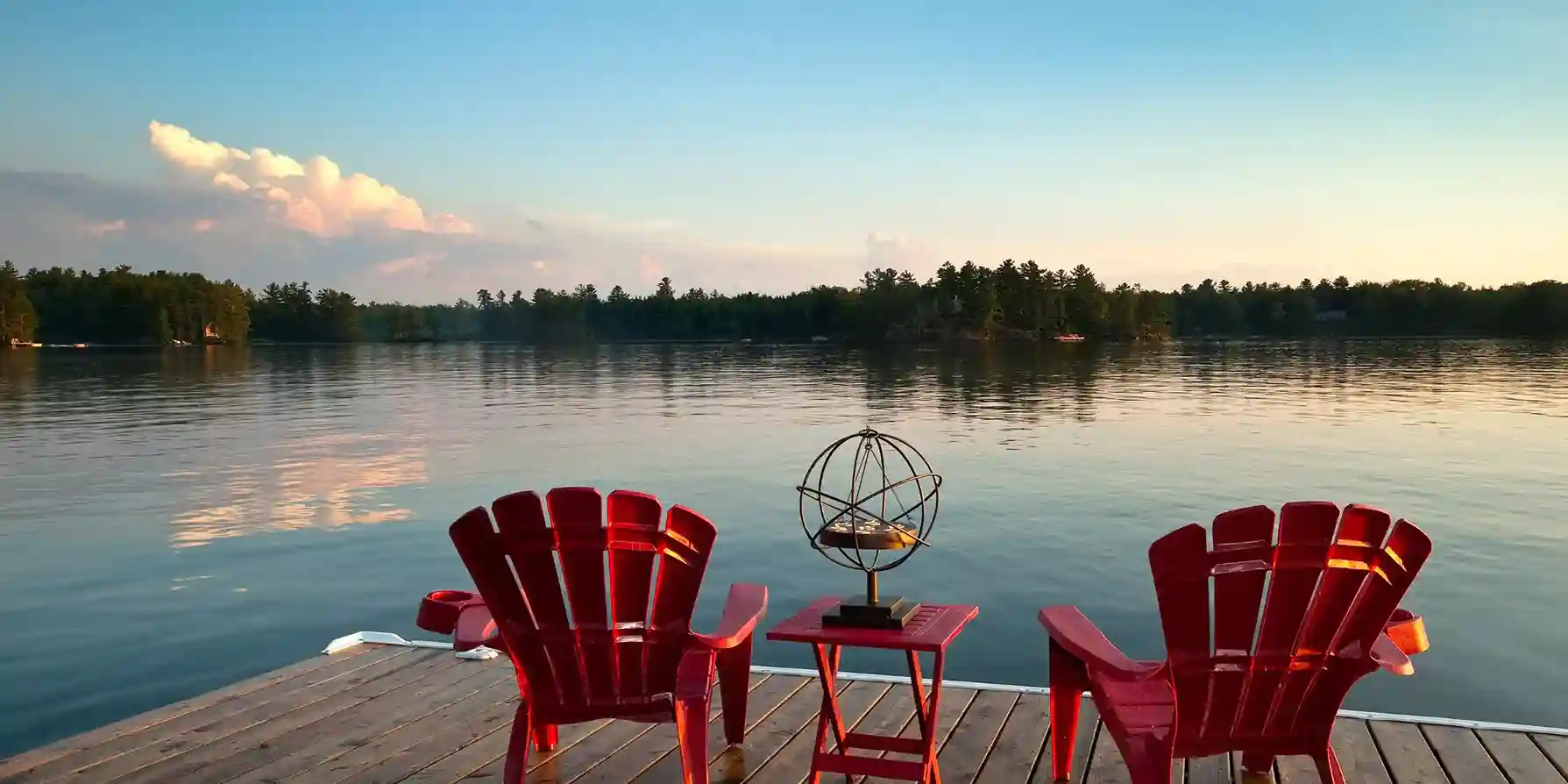 two muskoka chairs in canadian cottage country