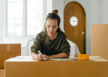A woman moving boxes