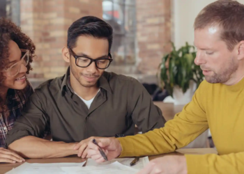A couple talking with a mortgage professional.