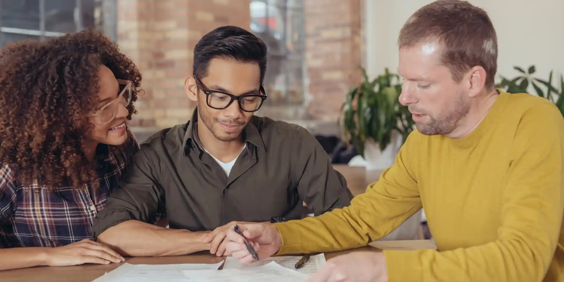 A couple talking with a mortgage professional.