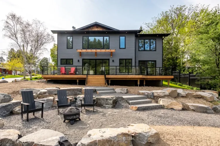 A large Muskoka cottage with a fire pit