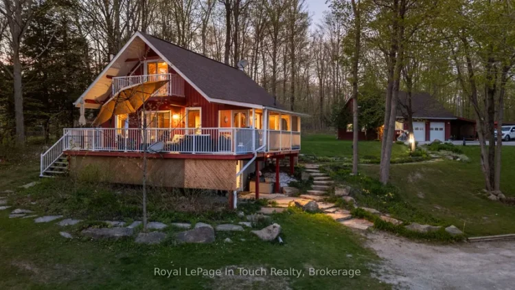 An exterior night time view of an Ontario cottage