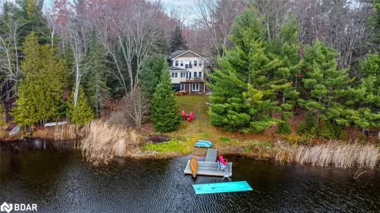 A scenic view of a lakefront Ontario cottage