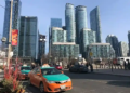 Toronto cab infront of skyline