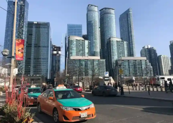 Toronto cab infront of skyline