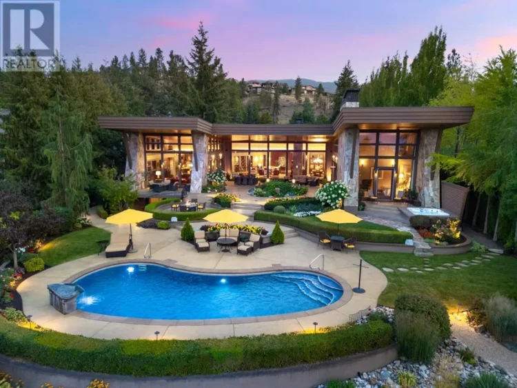 A large home featuring a pool and a spacious patio area for outdoor relaxation and entertainment.