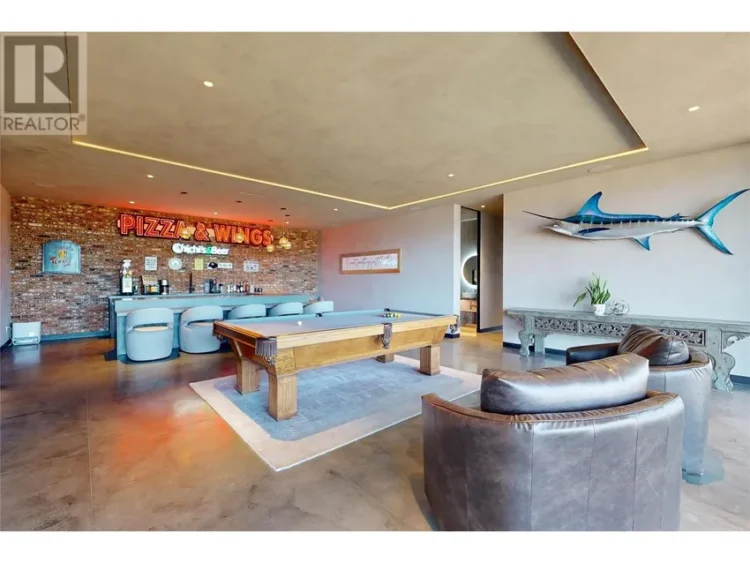 A home interior featuring a pool table beside a stylish bar.