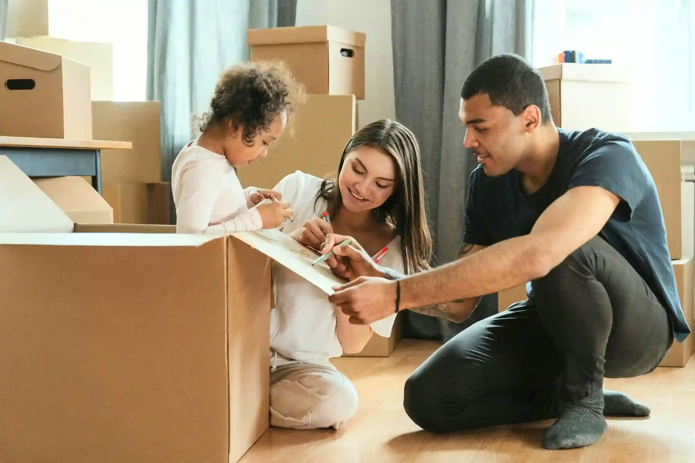 mom and dad packing with young child