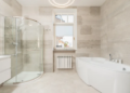 Interior view of a bathroom with a shower, sink, and toilet, showcasing a clean and modern design.