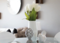 A circular glass table showcasing a minimalist style.