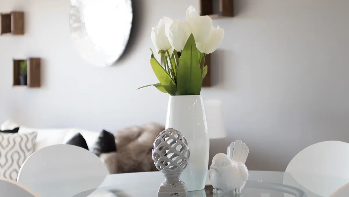 A circular glass table showcasing a minimalist style.