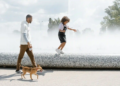 Dad and daughter walking dog