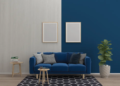 A blue sofa in a room featuring a white wall and blue accent walls, creating a cohesive color scheme.