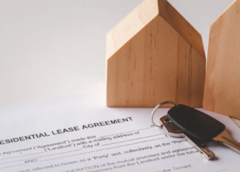 Two model homes, a residential lease agreement and a pair of keys.