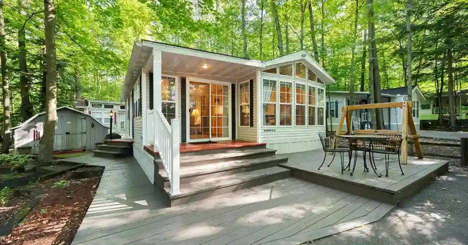 The exterior of a cottage in the woods