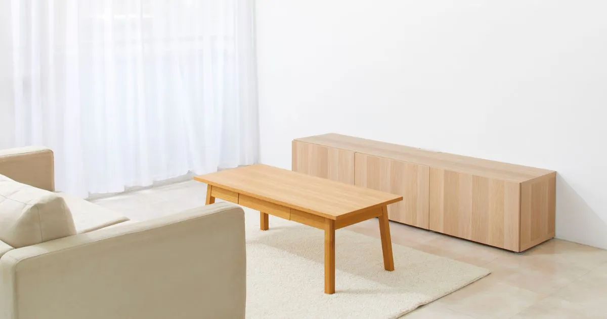 wooden coffee table and beige couch