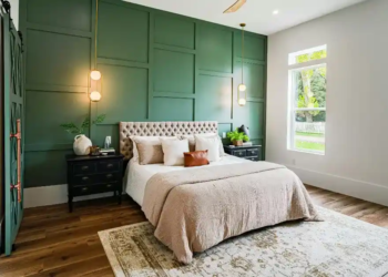 bedroom with green accent wall
