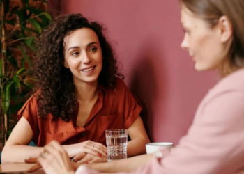 women talking in an office