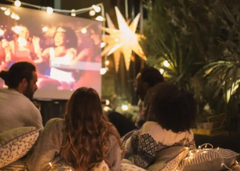 A group of friends watch a movie