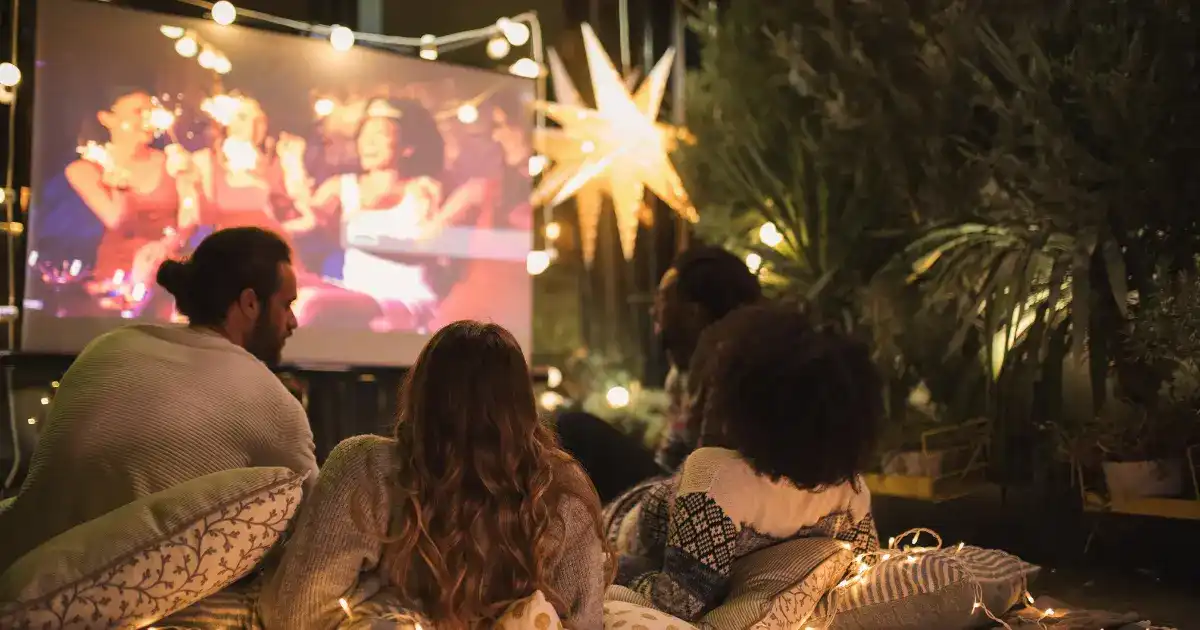 A group of friends watch a movie
