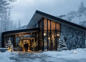 A luxury home covered in snow.