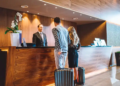 A couple checks into a hotel