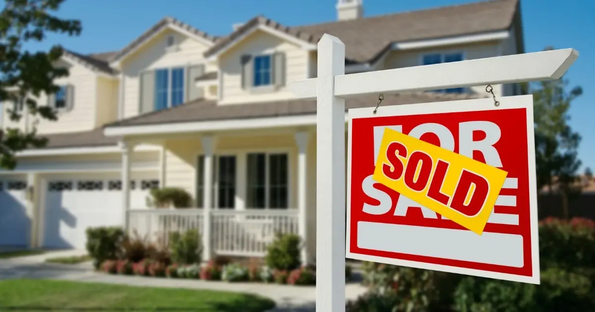house with a sold sign