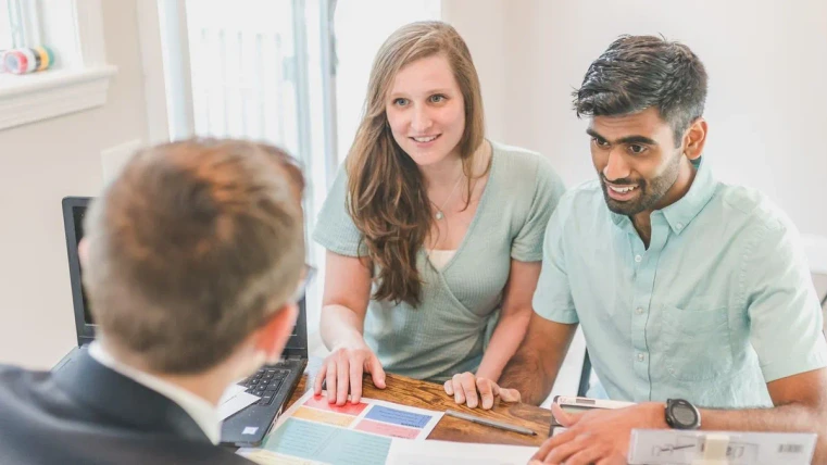 man and woman receive financial guidance