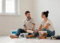 couple sitting in a room painting together