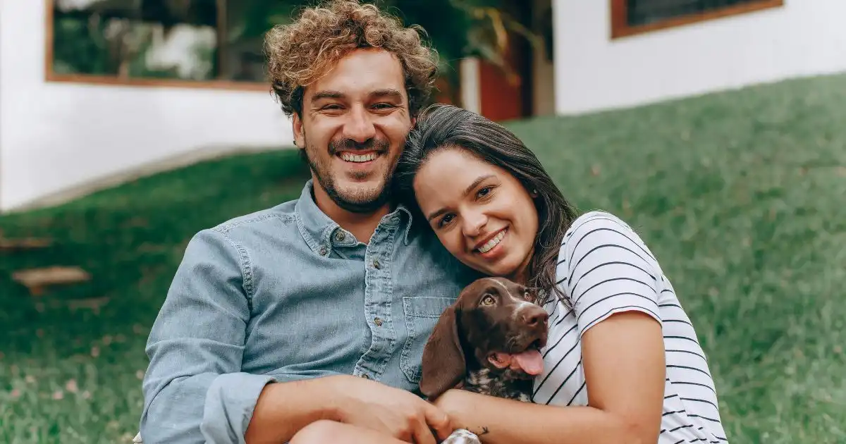 happy couple with dog