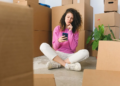 single woman searching for home on phone