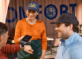 server at a restaurant speaking with customers