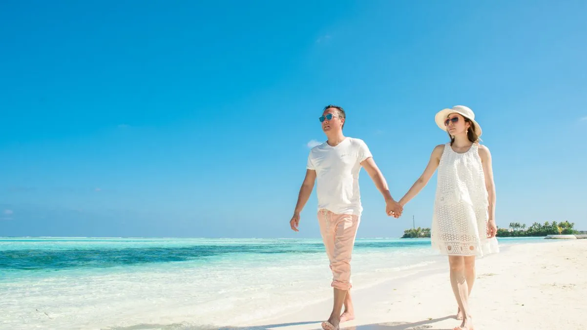 couple walking on florida beach florida starter home