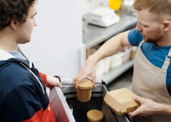 man working minimum wage job in kitchen