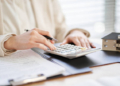Woman using calculator
