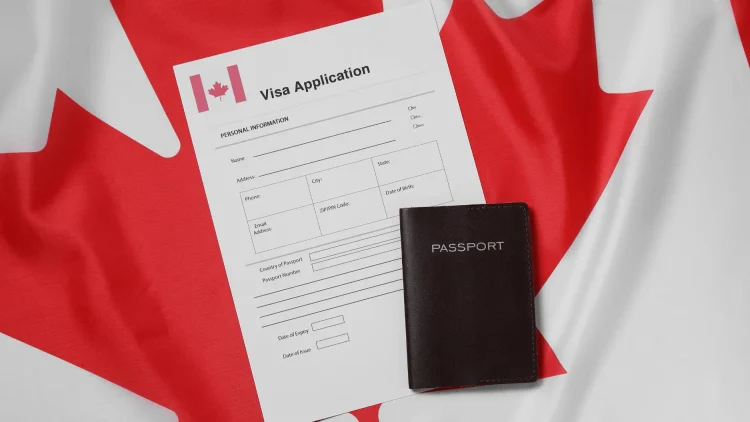 Canadian flag with visa application and passport