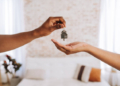 Real estate agent giving the keys to a new home