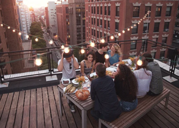 people having a rooftop dinner